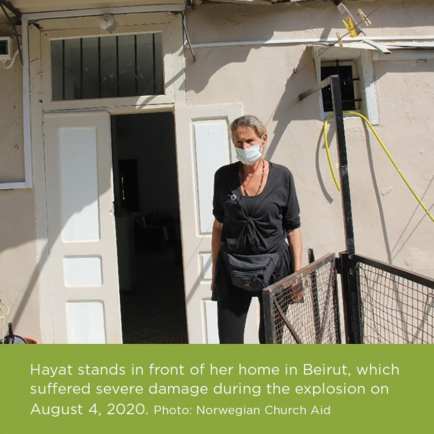 Hayat stands in front of her home in Beirut, which suffered severe damage during the explosion on August 4, 2020. Photo: Norwegian Church Aid