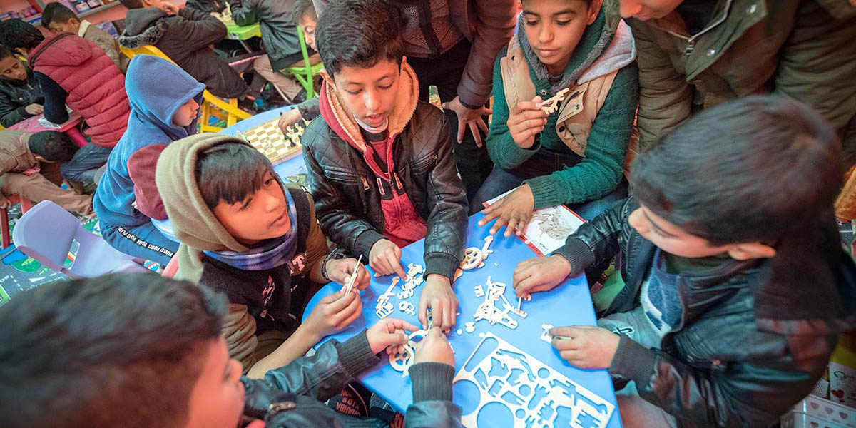 A group of students work together to solve a puzzle in the new “Space for Creativity” at Al Areen Secondary School for Boys, under the guidance of Nashmi, one of the school’s teachers.