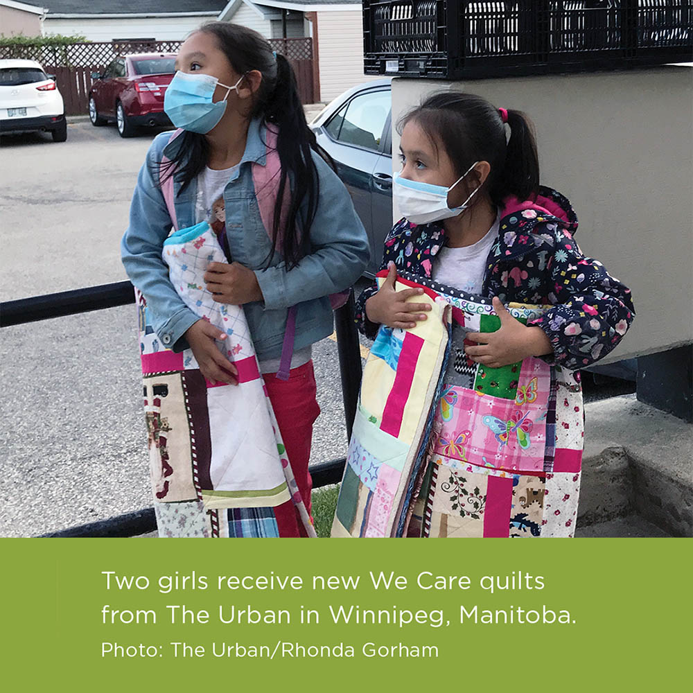 Two girls receive We Care quilts from The Urban in Winnipeg, Manitoba. Photo: The Urban/Rhonda Gorham