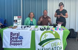 Sharon Miranda, Coordinator of Deaf Student Supports, and Michael Merritt, Deaf Navigator stand in front of a garden.