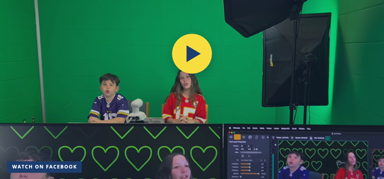 Two Clark Mills students anchor a CMTV broadcast in front of the green screen