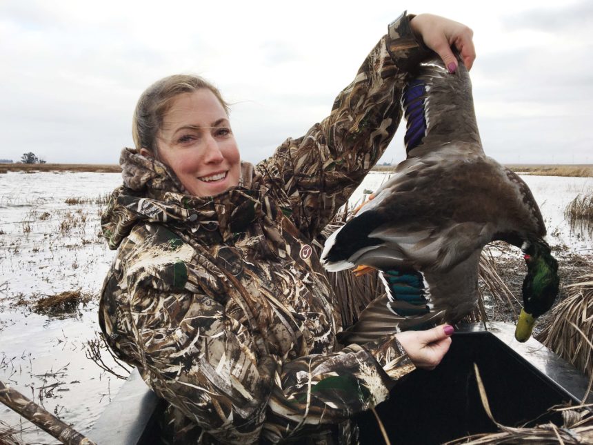 Hunter with a drake mallard