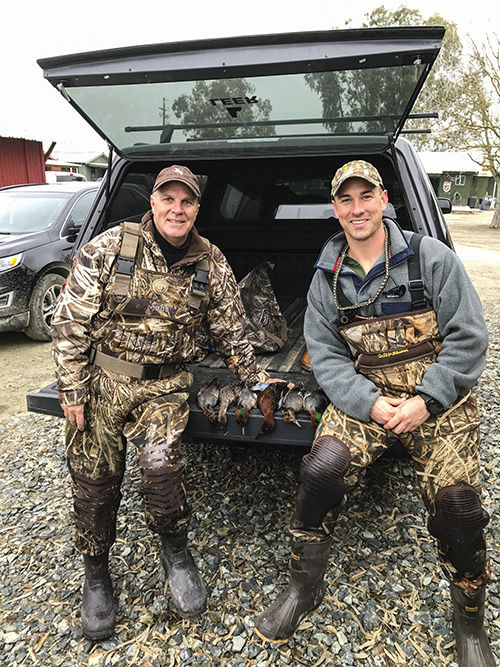 Two hunters pose after a hunt at Rancho Visalia with California Waterfowl.