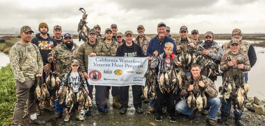 A group of veterans pose after a California Waterfowl hunt.