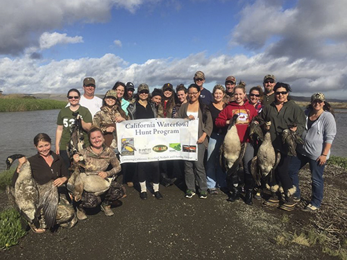 A group of female hunters pose after a hunt with California Waterfowl at Grizzly Ranch.