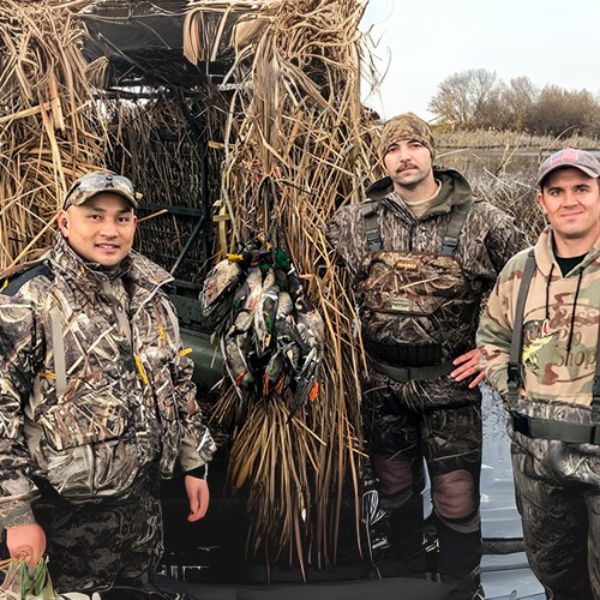 A group of hunters pose after a hunt at McDonald Island with California Waterfowl.