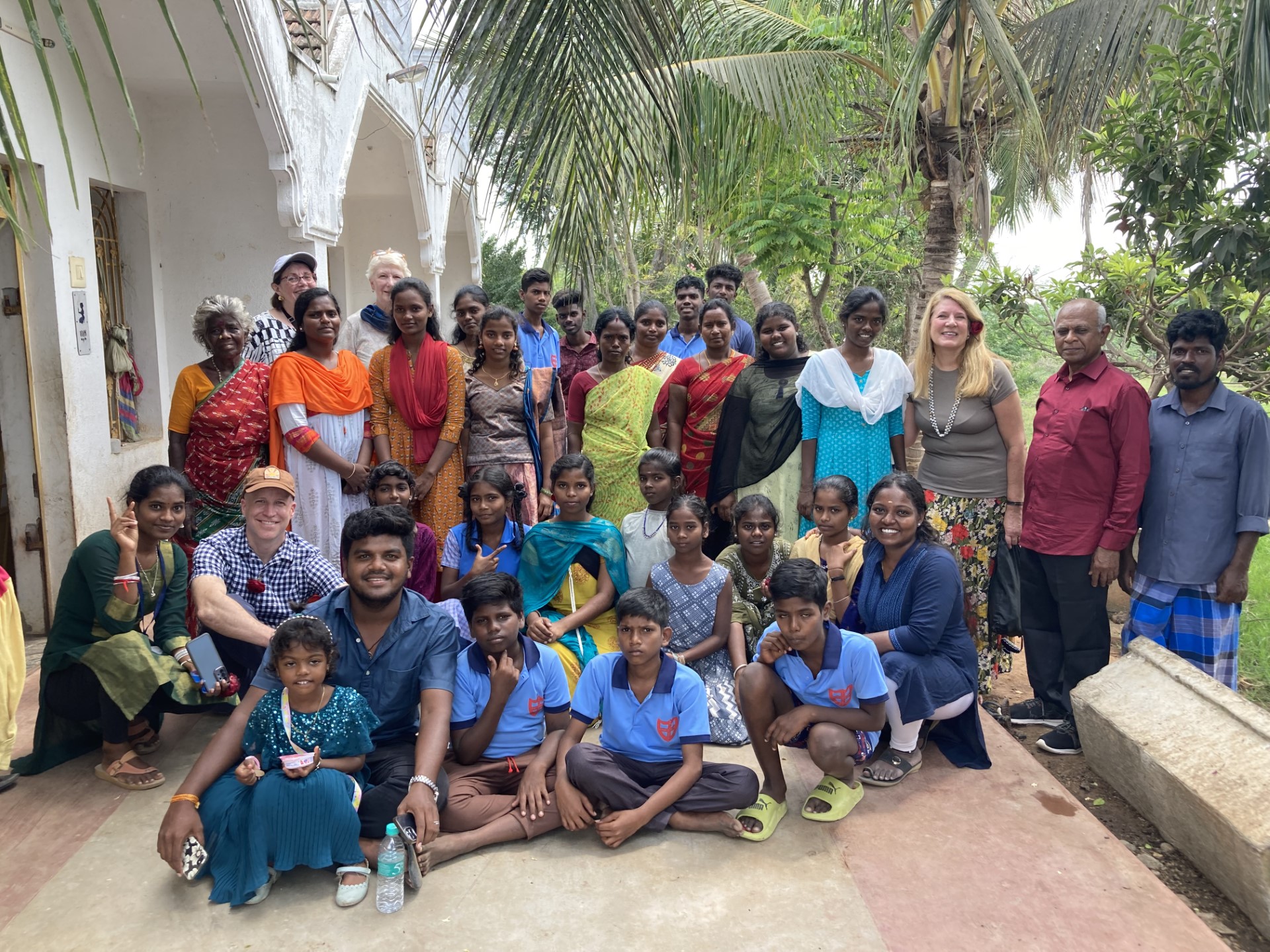 Visiting students in their village