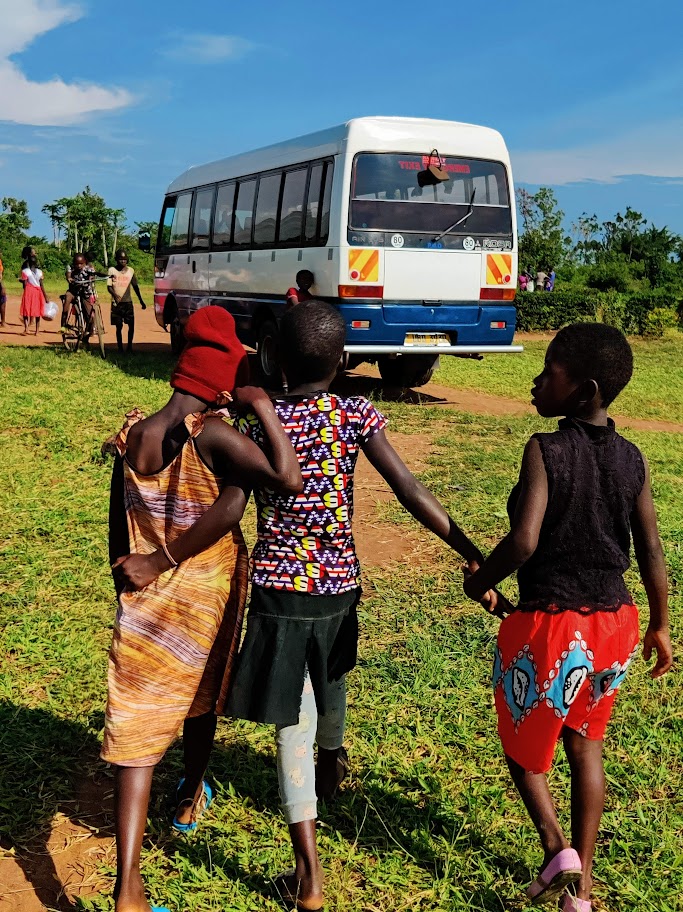 3 young girls walking while embracing