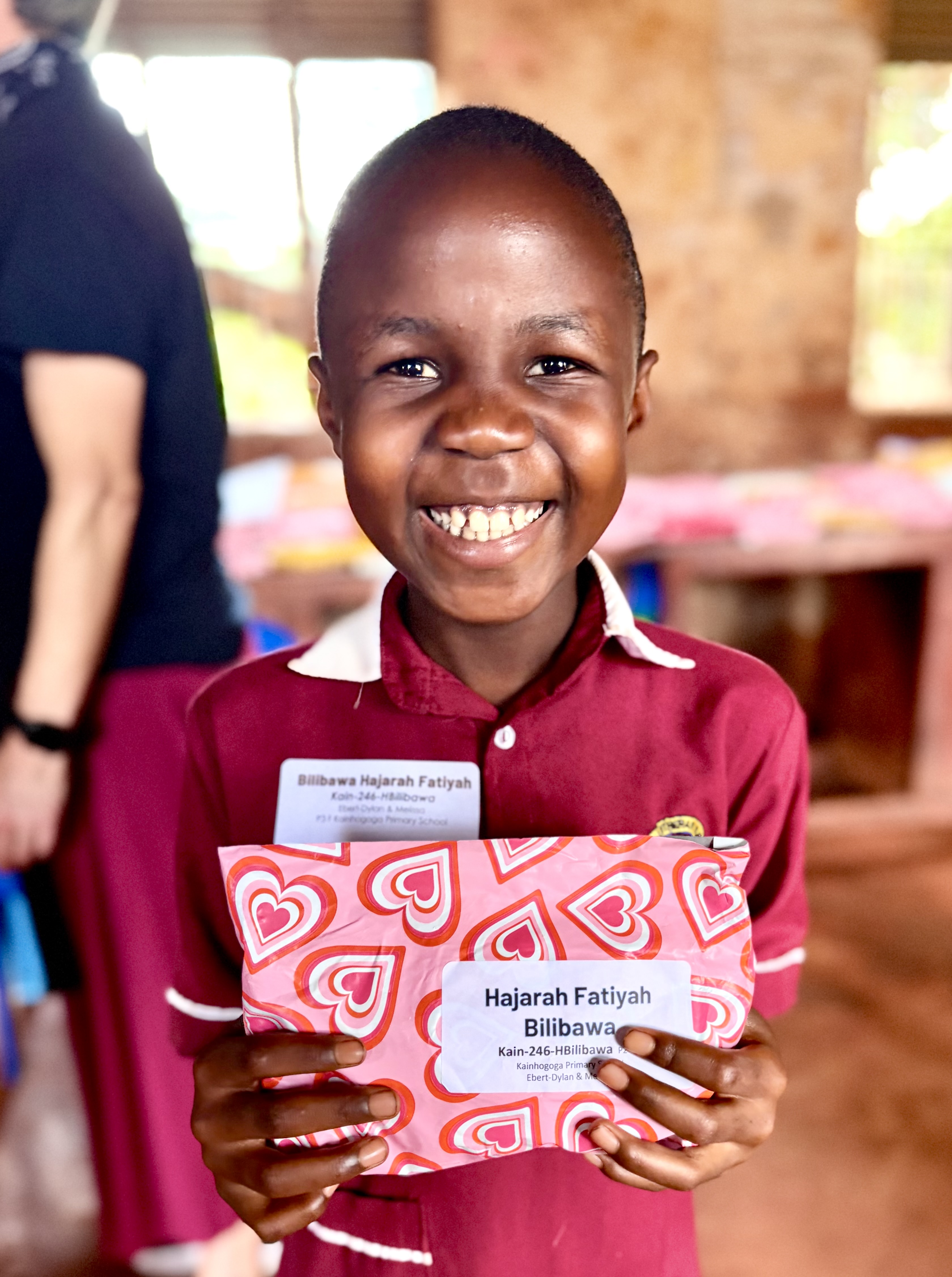 girl student holding packet from sponsor