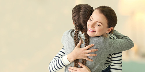 Woman and child hugging