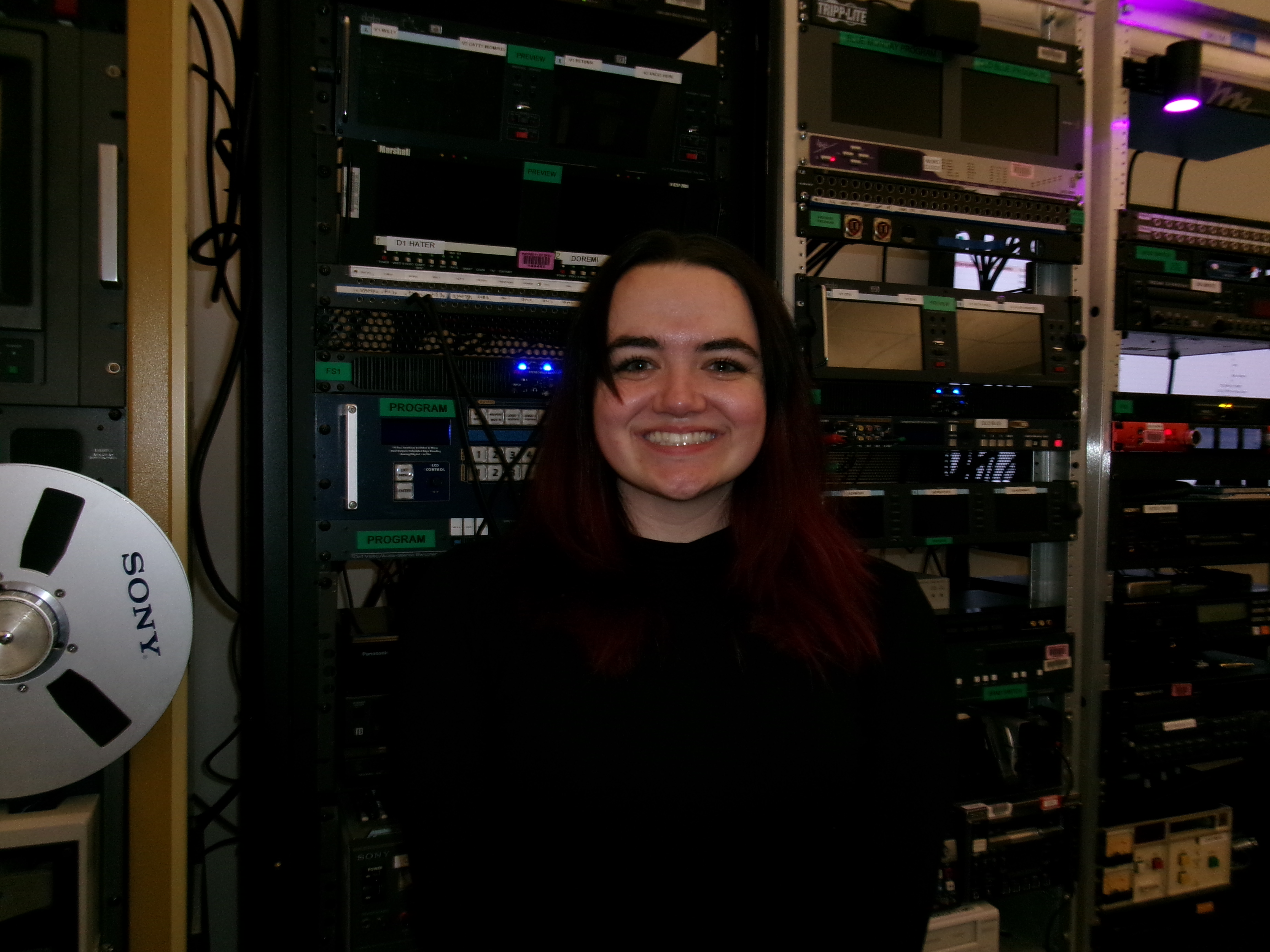 Isabella Mayer in front of broadcast communication studio