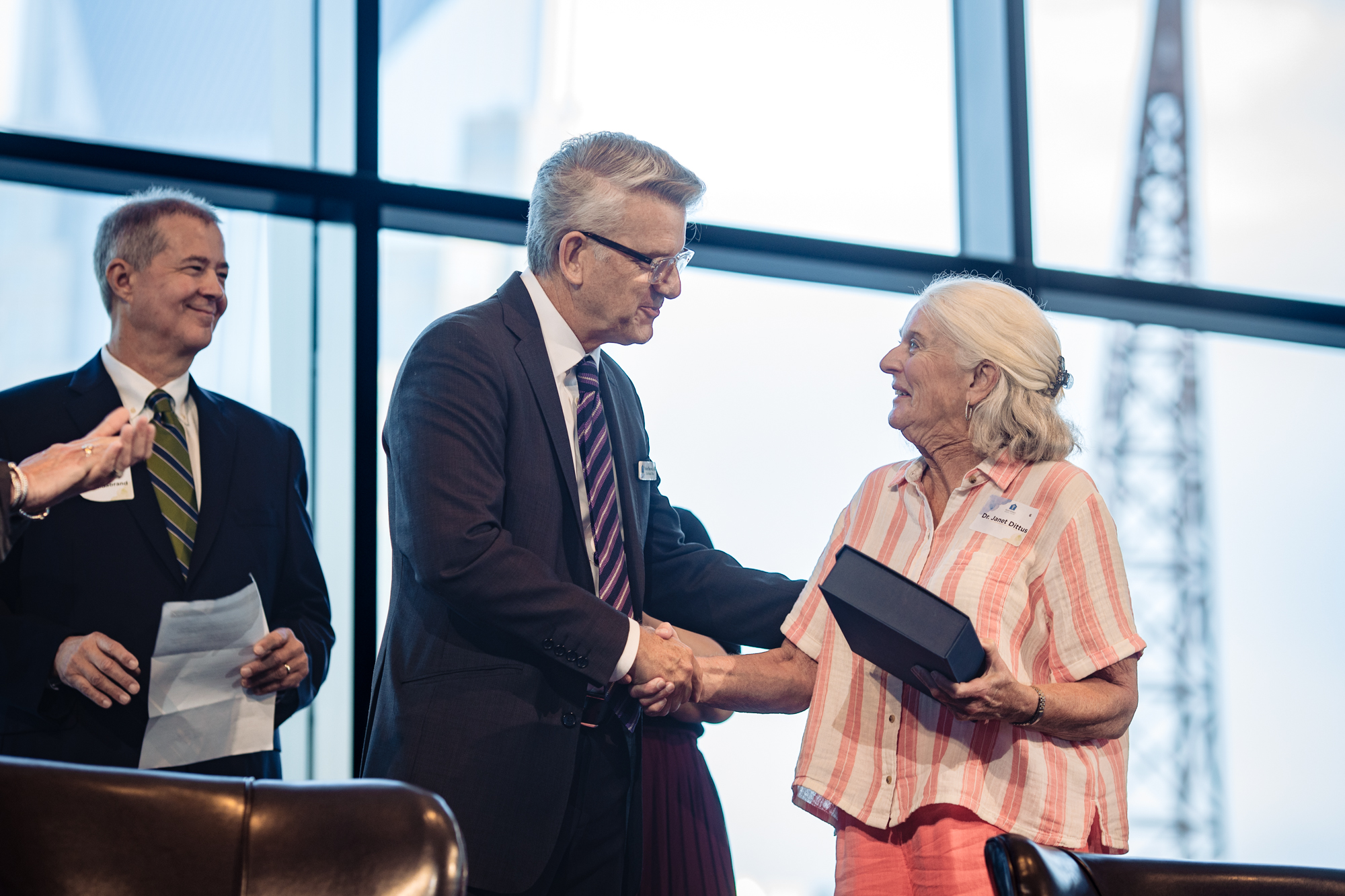 Volunteers welcoming guests