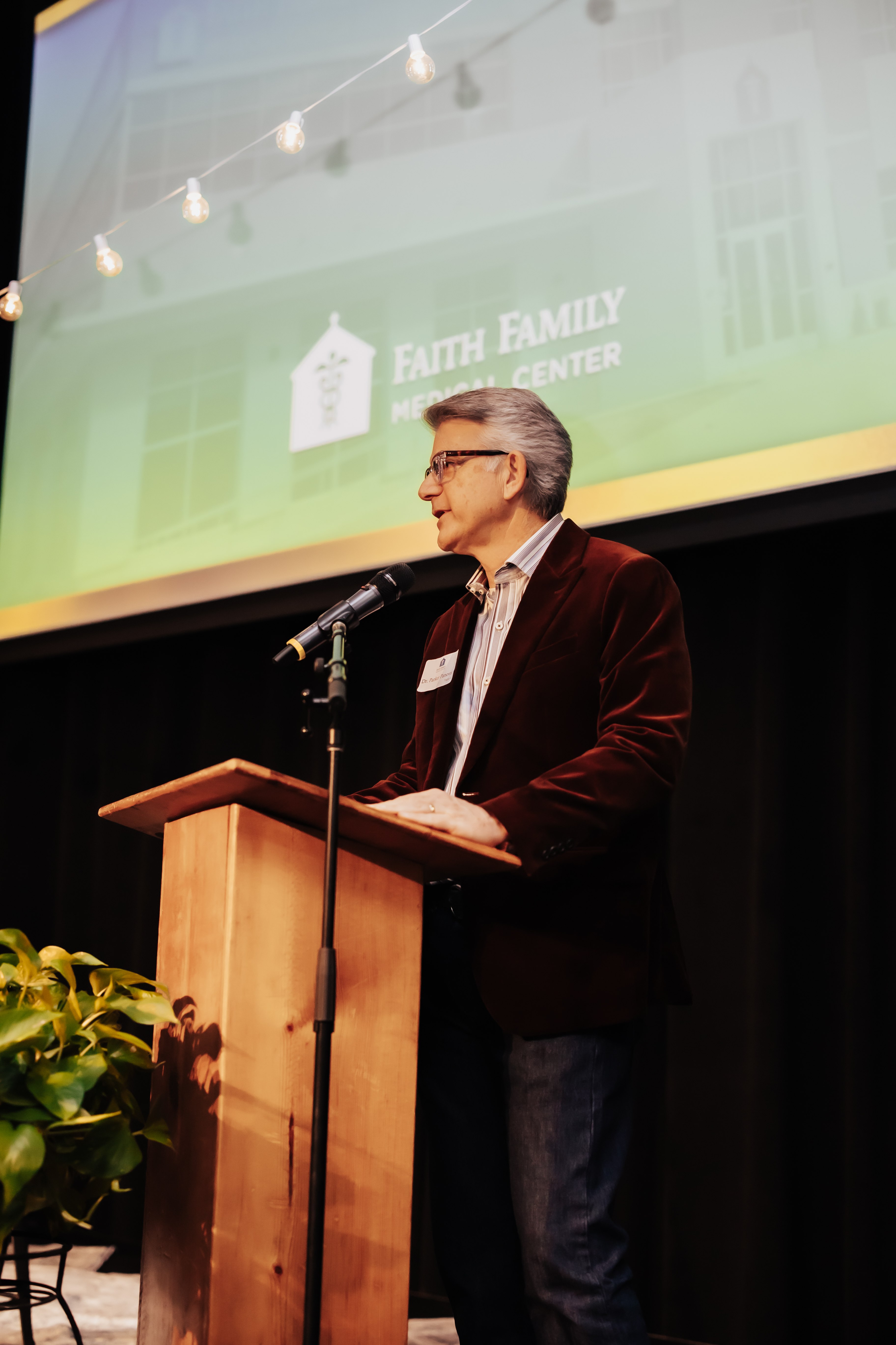 Doctor speaking to the crowd