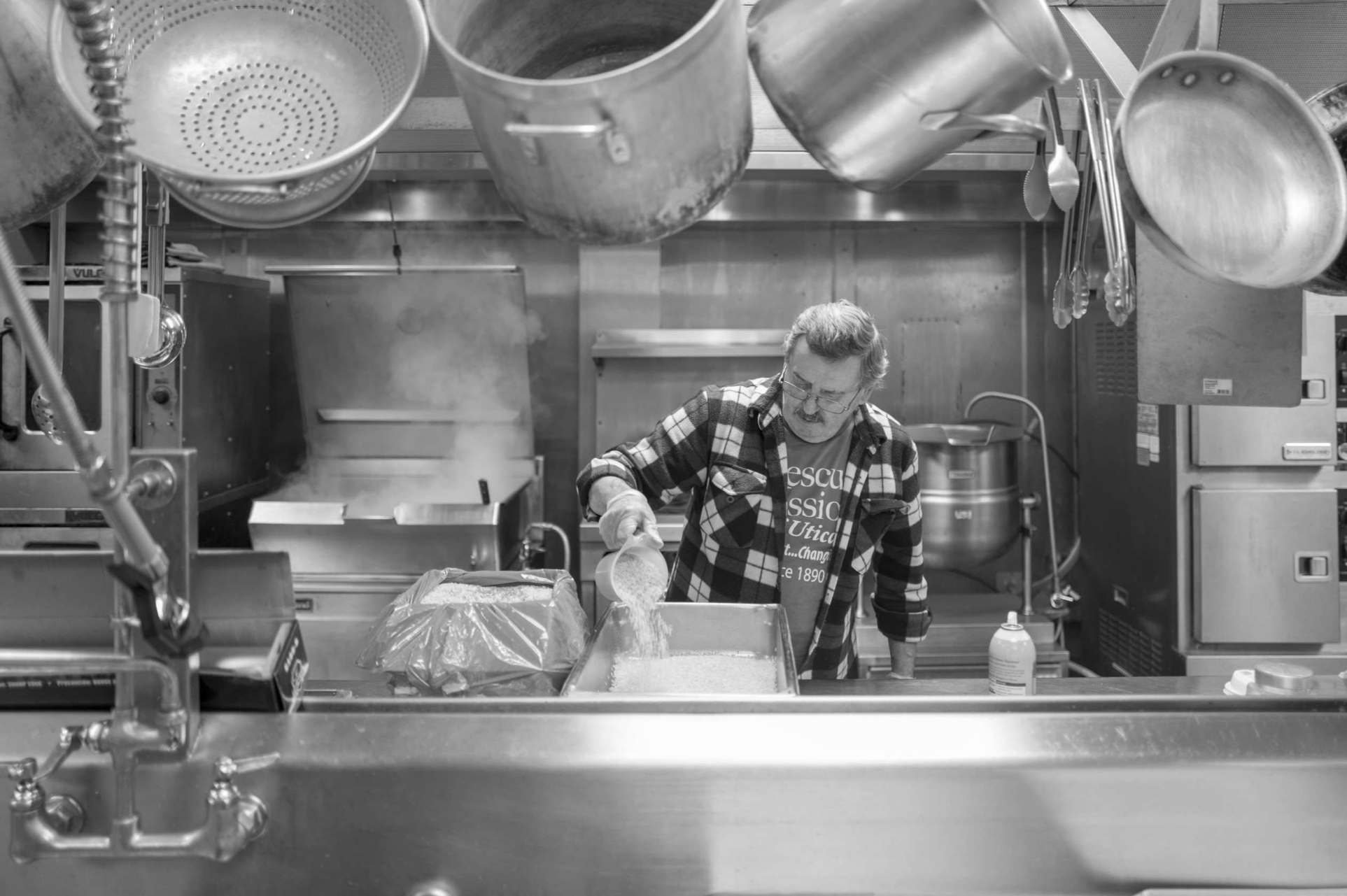 A man preparing food in a kitchen