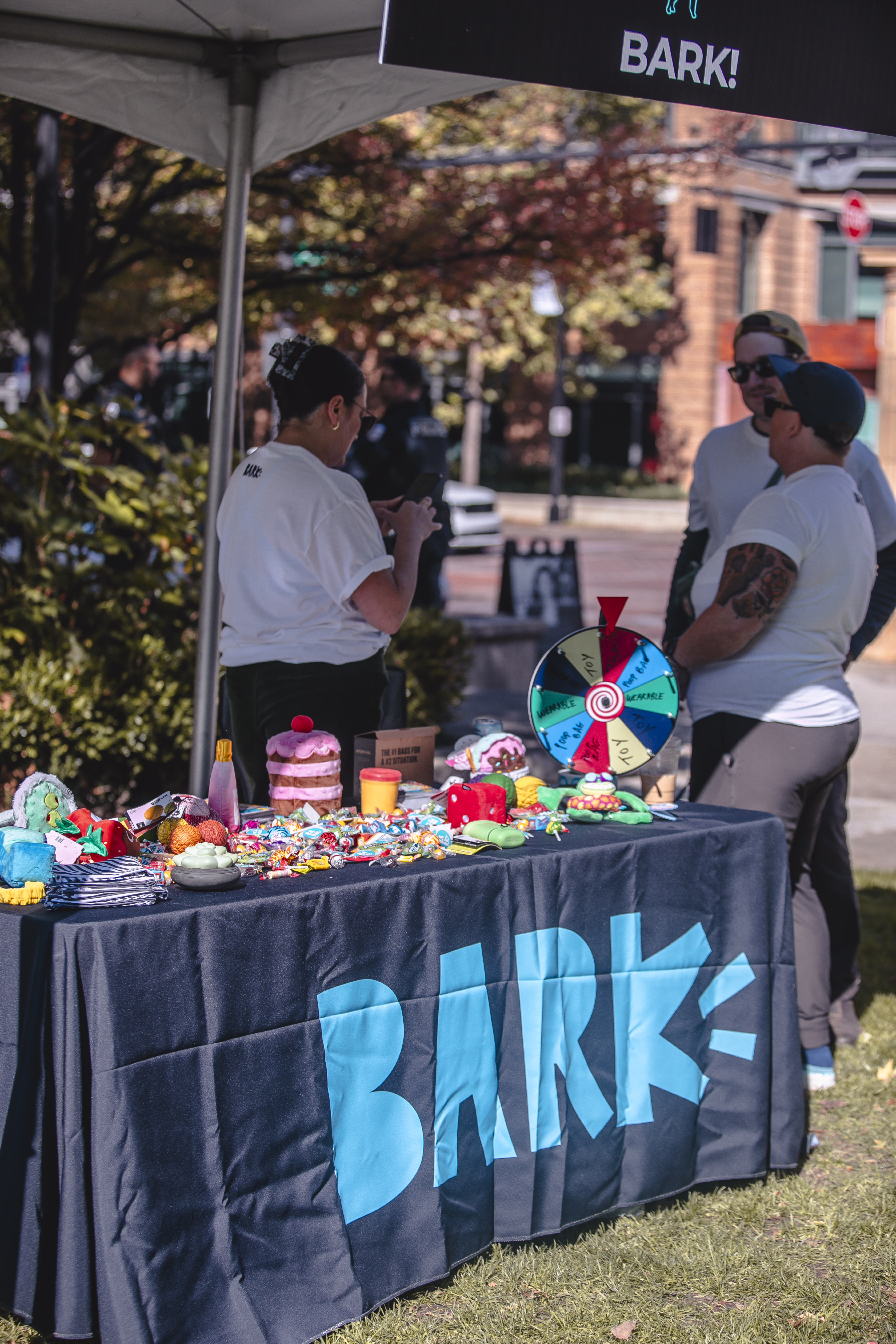 A vendor booth stocked with dog toys and treats
